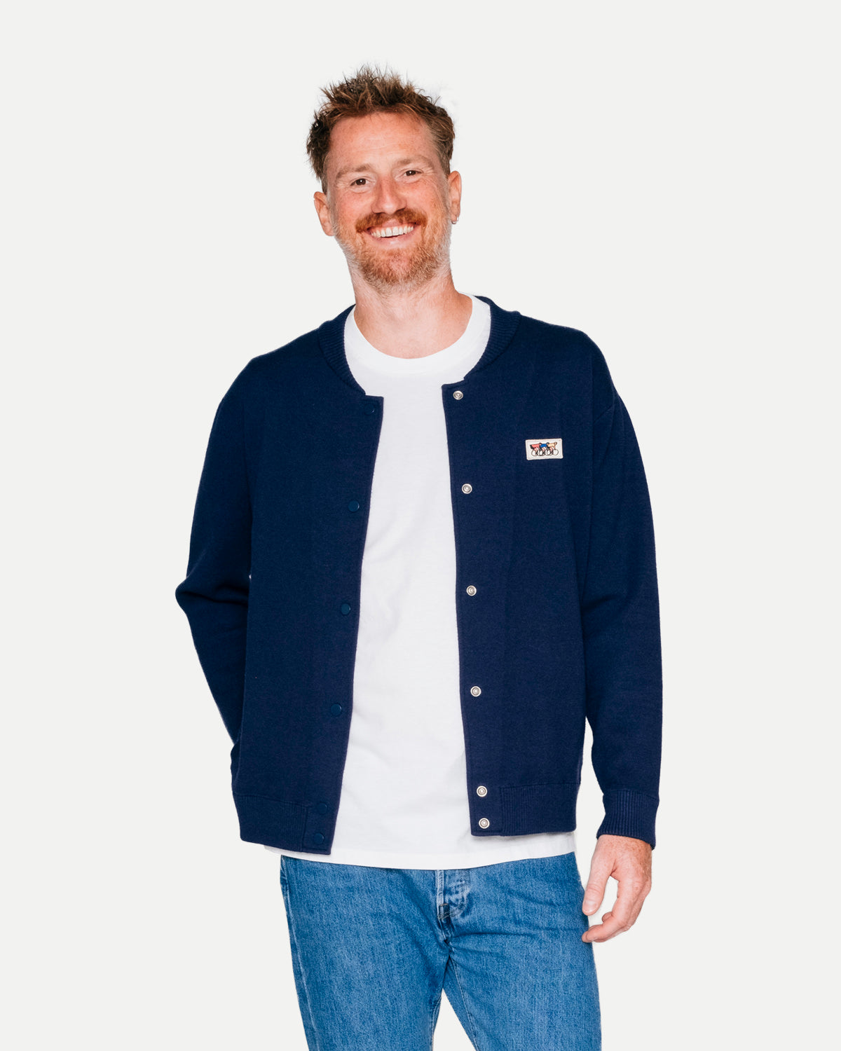 Navy varsity jacket by Erstwhile, front view