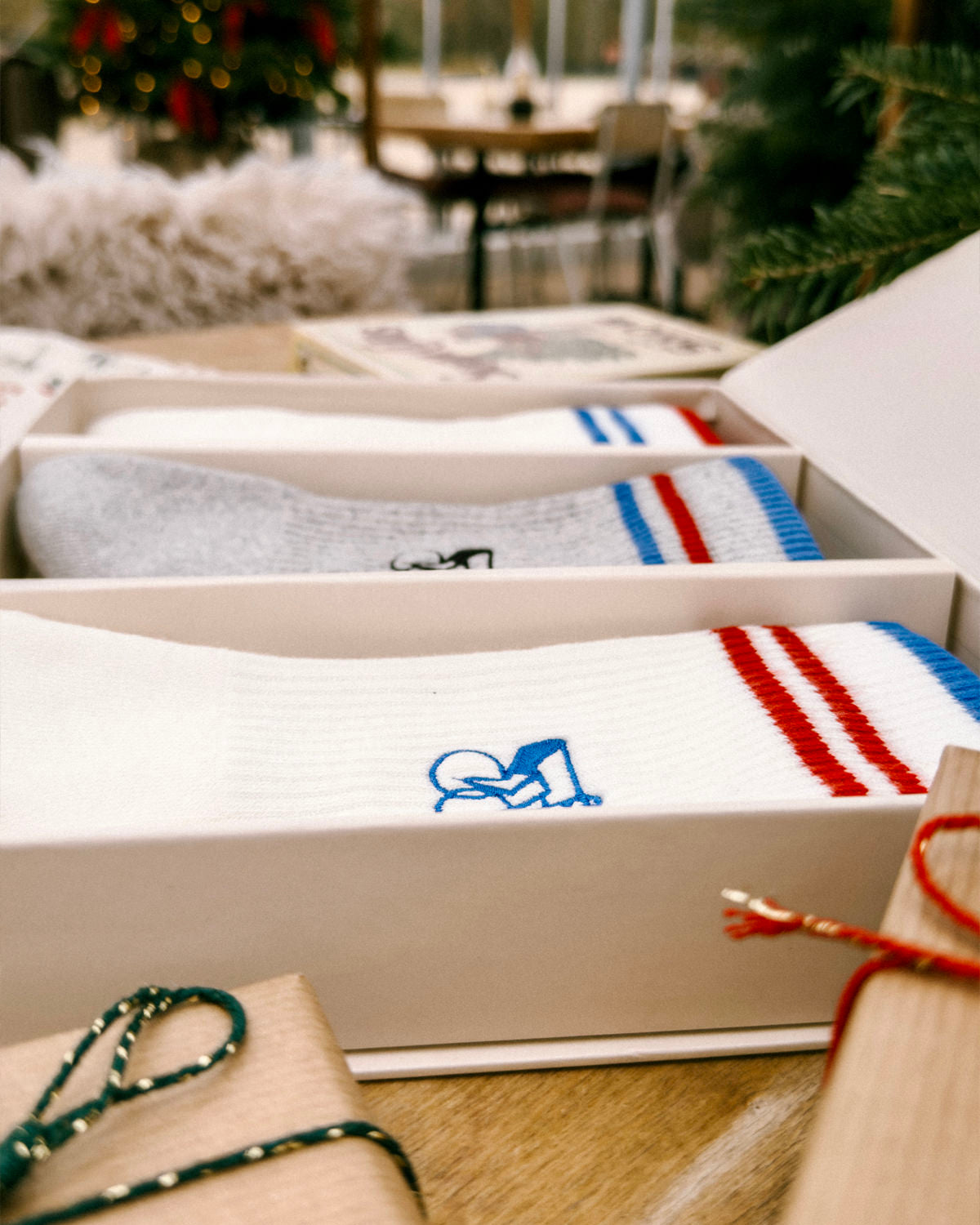 Detail of the Erstwhile gift box with red and blue socks