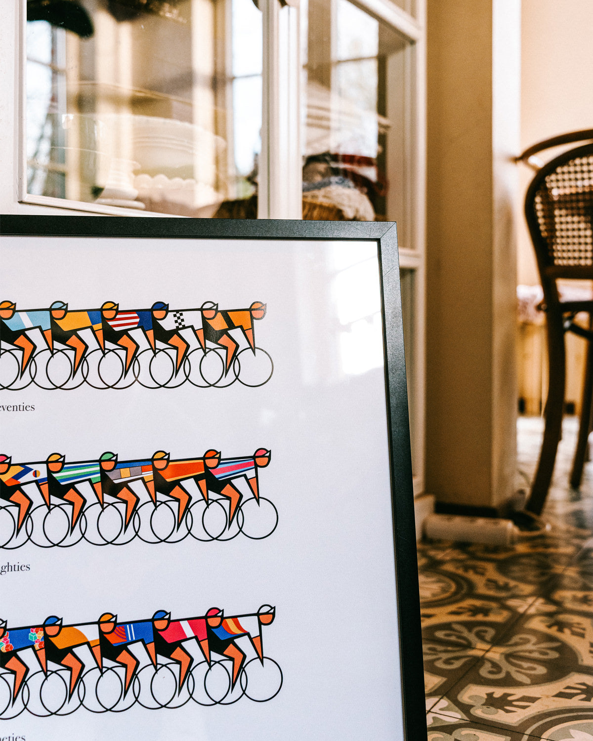 Close-up of the cycling poster The Eras