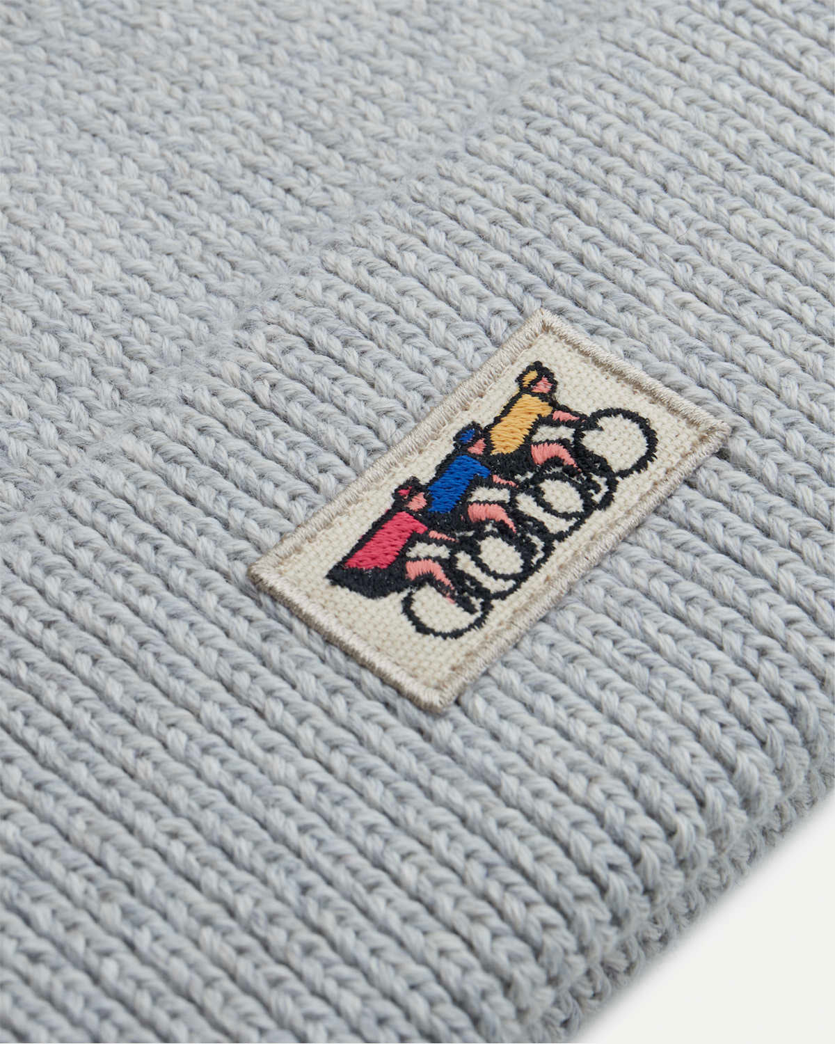 Close-up of the grey mélange knitted beanie