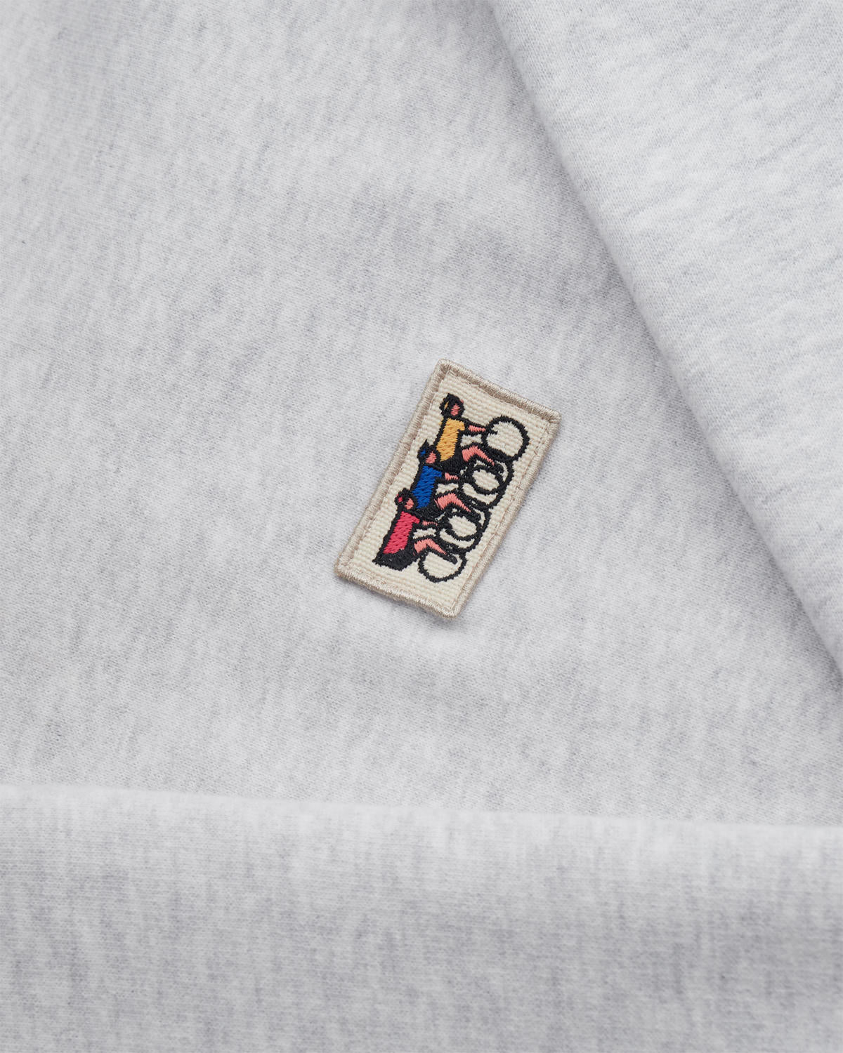 Close-up of the light grey zip sweatshirt