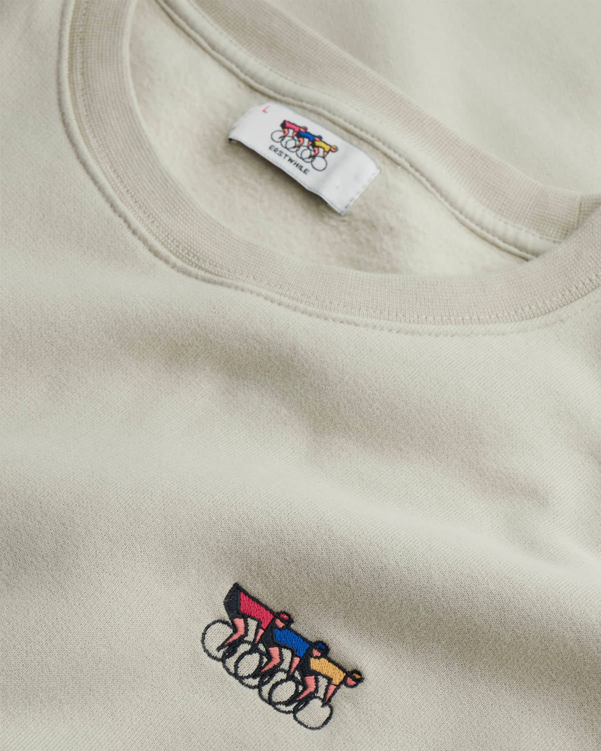 Close-up of the faded olive Waaier sweatshirt
