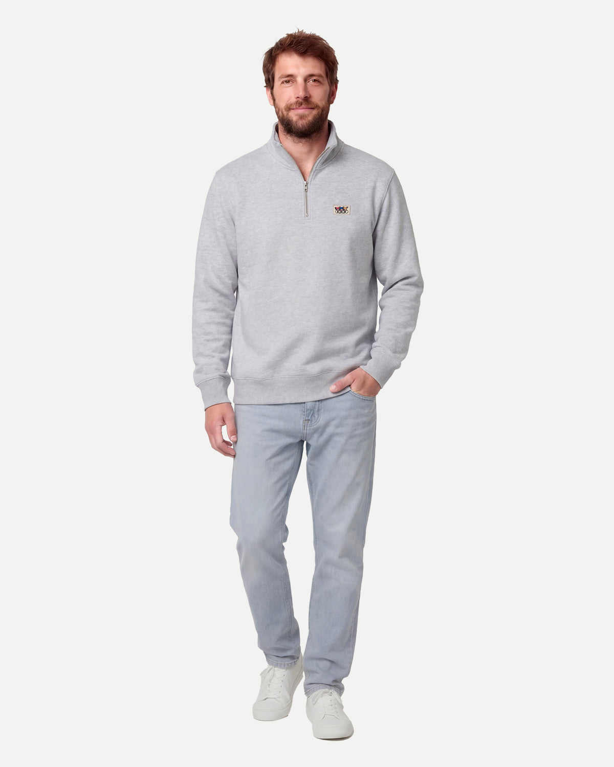 Model wearing the light grey zip sweatshirt