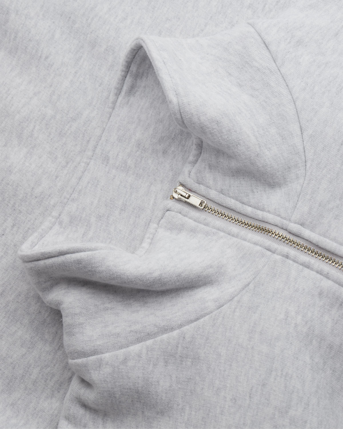 Close-up of the light grey zip sweatshirt