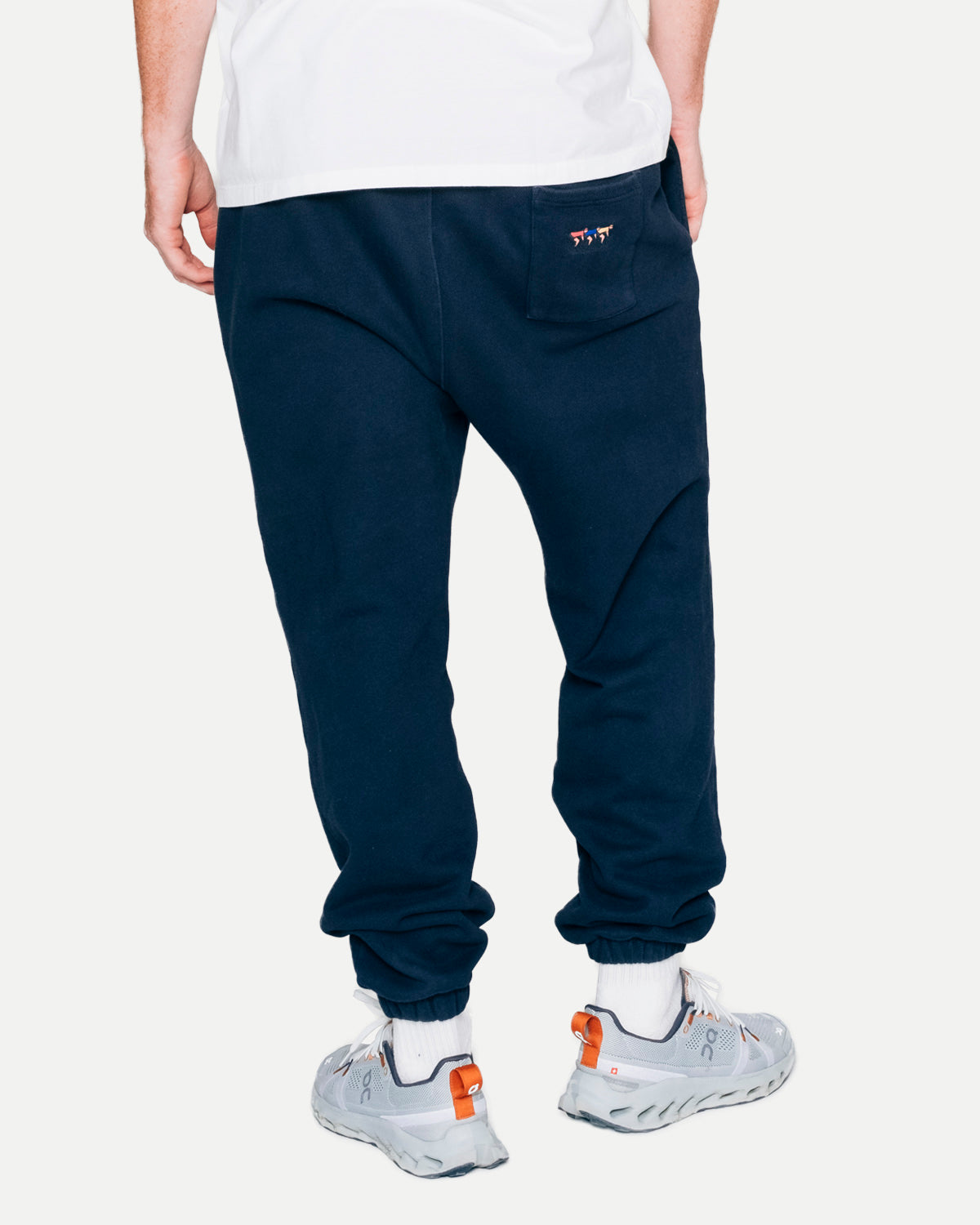 Close-up of the navy sweatpants, back