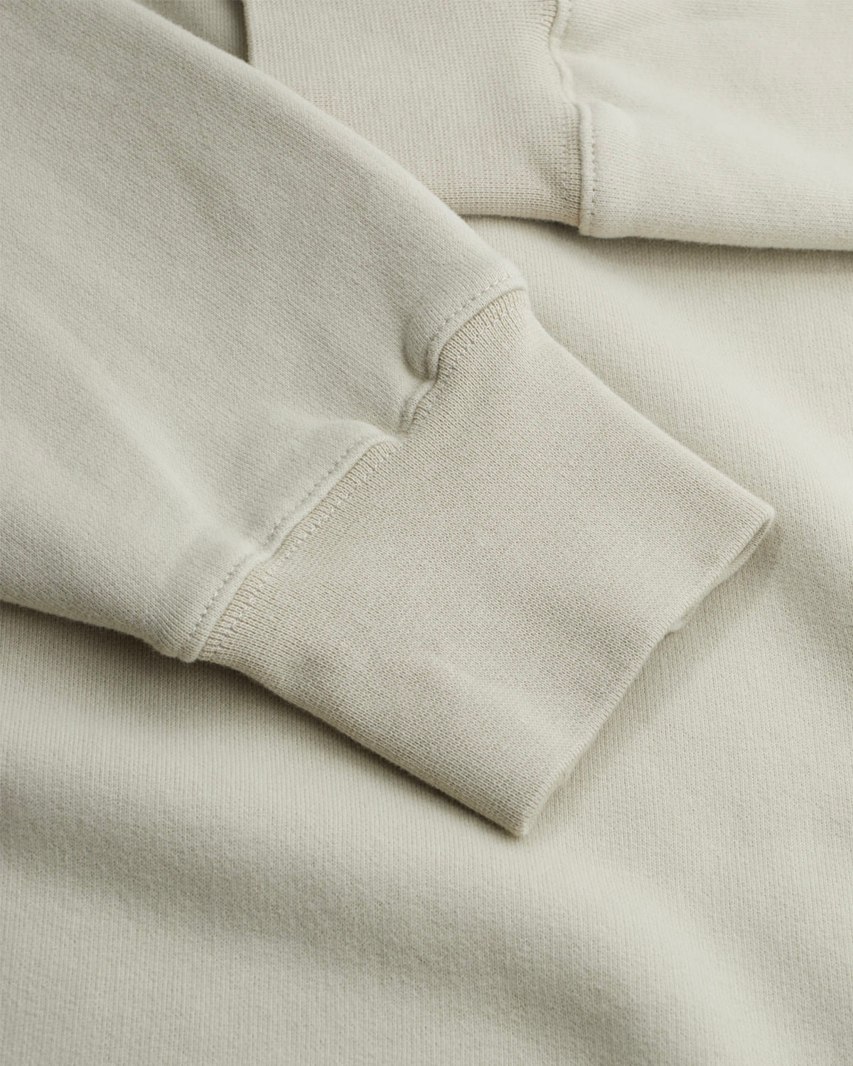 Close-up of the faded olive Waaier sweatshirt