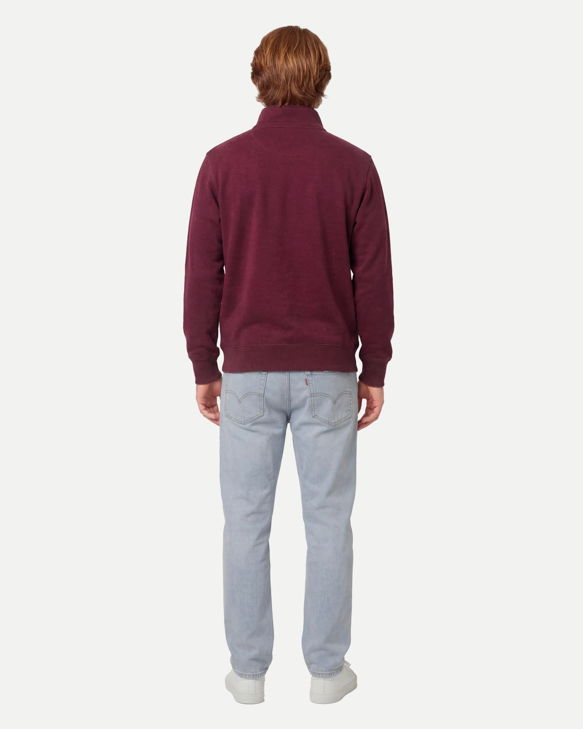 Model wearing the fig zip sweatshirt, seen from the back